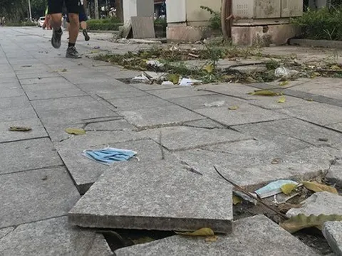 Lát đá vỉa hè ở Hà Nội: Vì sao cứ đào lên lát lại?