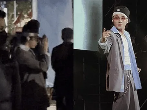 Sơn Tùng được dàn vệ sĩ hùng hậu hộ tống đi diễn, che dù đen vây quanh không một kẽ hở