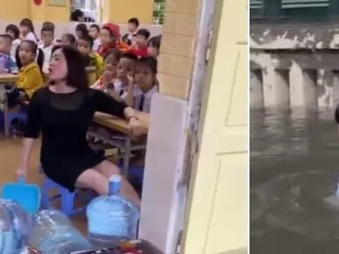 Hà Nội mưa lớn, cô giáo vừa dạy học vừa tát nước, học sinh bơi giữa sân trường